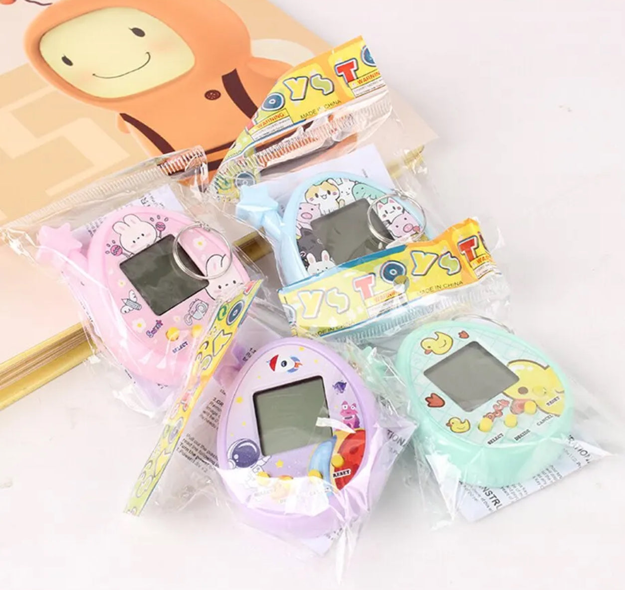 2Pcs Electronic Pet Machine Virtual Pet Raising Mini Handheld Game Console Random Color Keychain Toy